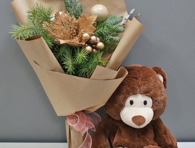 New Year bouquet of ornaments and tree, and a bear gift with candies photo